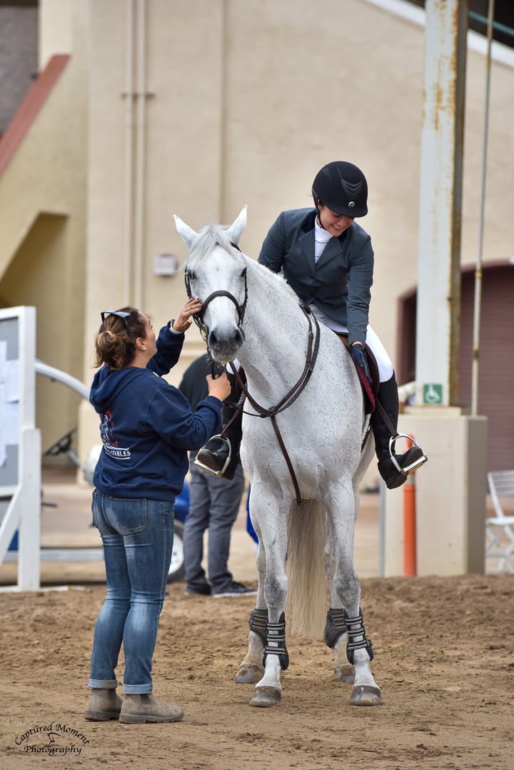 Coach and rider preparing horse for show at Hegewisch Stables