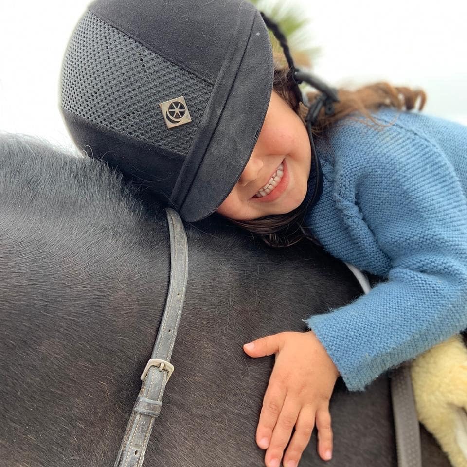 kid on horseback during a pony ride